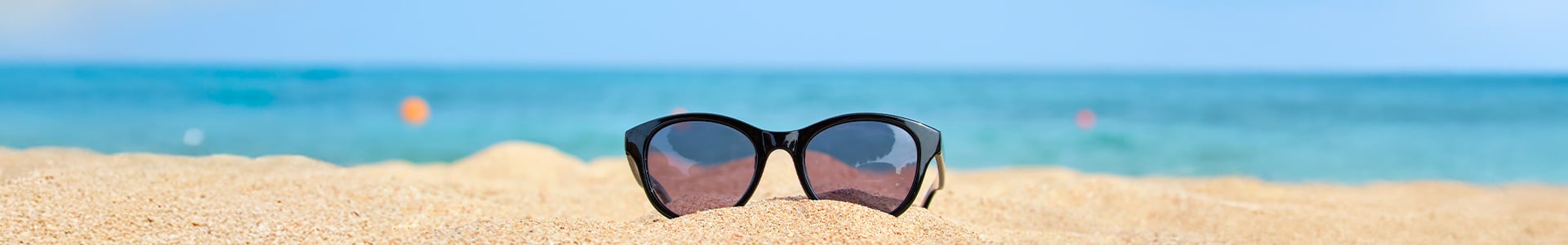 Sunglasses in sandy beach